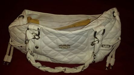 White handbag with dust cover