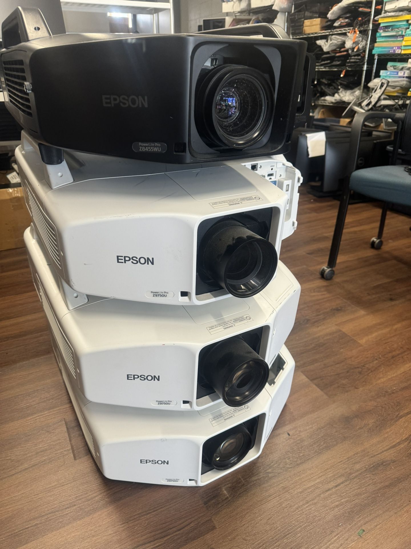 Four huge EPSON projectors modles shown in the pictures all for $2000 They were in working condition before taking off the service current working co