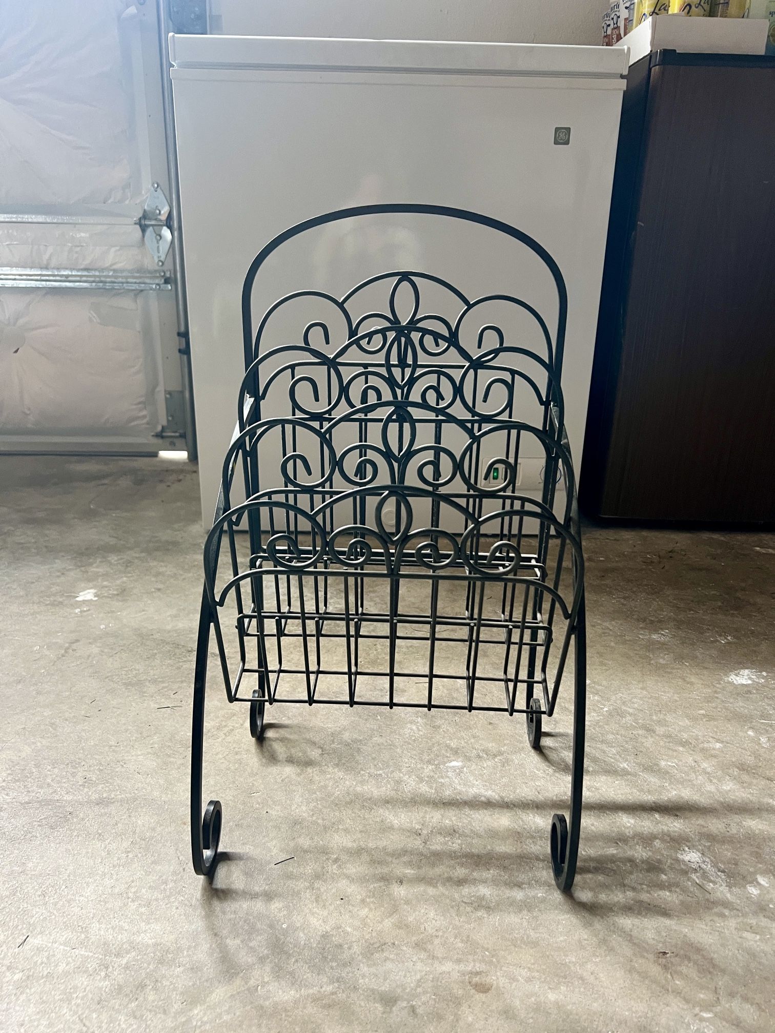 black wrought iron magazine rack
