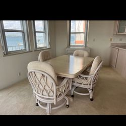 Dining room table and 4 chairs on castors