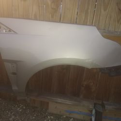 2015 Cadillac SRX Passenger Fender Light Damage On The Front Corner