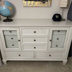 White dresser with multiple drawers