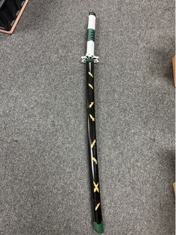 A replica of the Wind Hashira Sanemi Shinazugawa's Nichirin Sword from *Demon Slayer: Kimetsu no Yaiba*, featuring the signature green hilt and black 