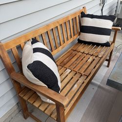 Wooden Outdoor Bench with Pull-Out Table and Pillows