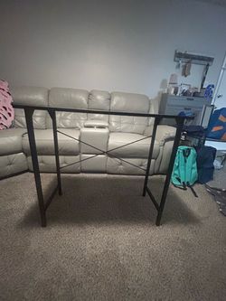 a compact black desk