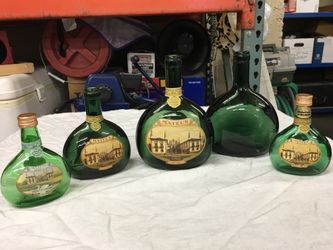 Gorgeous green glass vintage bottles