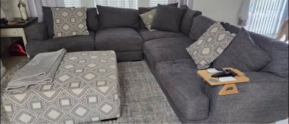 Grey sectional with ottoman