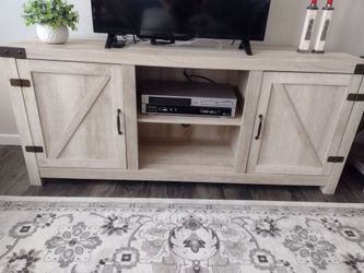 Farmhouse console table/ TV stand with two drawers and two shelves in the middle.