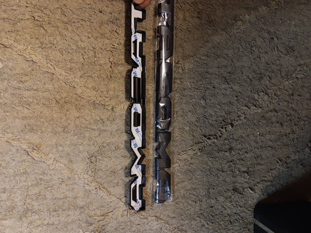 Toyota Tacoma  Overlay blackout emblems, fits model year 2016 through 2023.
