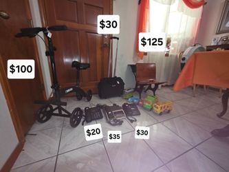 Vintage child desk, radio/alarm telephones, big button telephone, little people vehicles, laptop rolling bags, used for below the knee injuries.