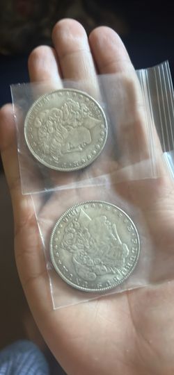 I’m open to offers. Two Morgan sliver dollars.