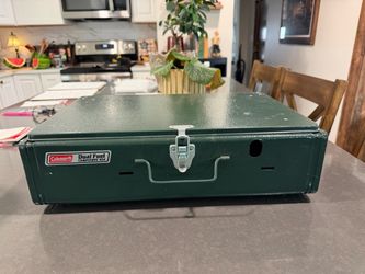 The Vintage Coleman Camp Stove 424 is a two 2-burner dual fuel, used once