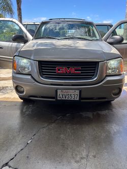 GMC Envoy SUV – Tan/Gold