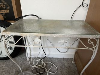 Iron table with glass.