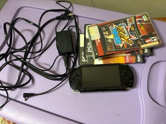 Sony PSP with Charger and Games