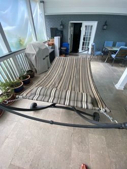 Striped hammock with metal stand and pillow