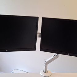 Humanscale Adjustable Dual Monitor Arms and 2 HP Monitors 23”