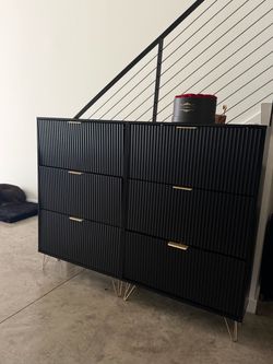 2 black shoe cabinets
