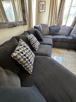 Large Gray Fabric Sectional Sofa with Pillows from Ashleys furniture