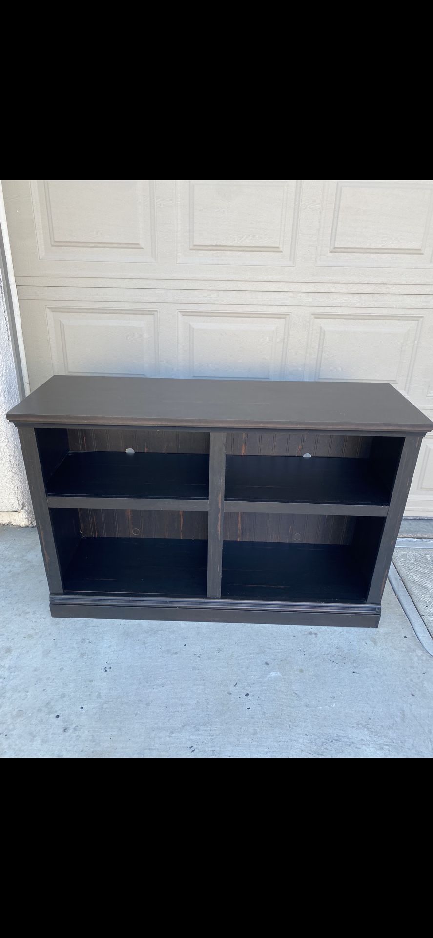 Tv Stand holding 65 inch TV