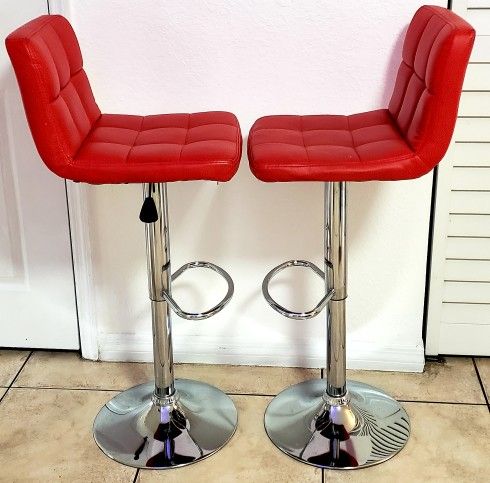 Bar stools, glass diner table and TV
