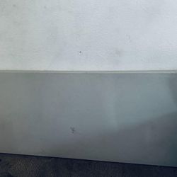 6-foot rectangular plastic folding table with a tubular steel frame, commonly used for indoor and outdoor events.