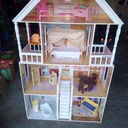 4 1/2 Ft Dollhouse Like New With Accessories .