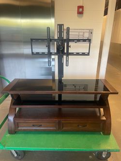 TV STAND WITH ATTACHED MOUNT GLASS TOP  SHELVES AND TWO STORAGE DRAWERS