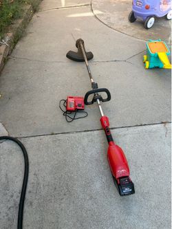 Milwaukee M18 Fuel string trimmer and 8.0 HO battery