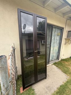 Dark brown bookcase glass doors