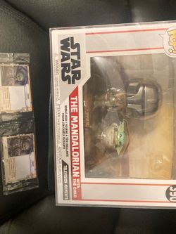 The mandalorian and grogu funko and AMC cards