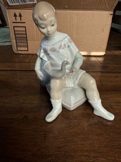 Lladro Porcelain Boy with Bird Figurine