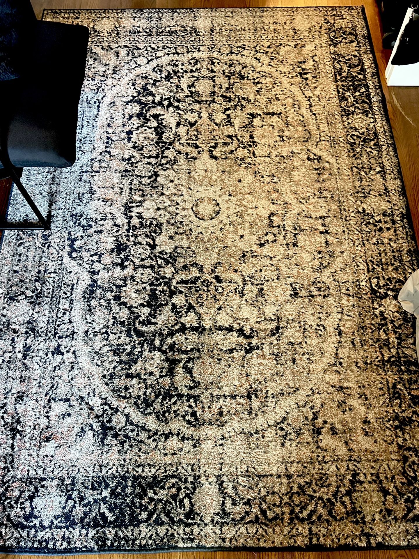 Black & tan low pile rug