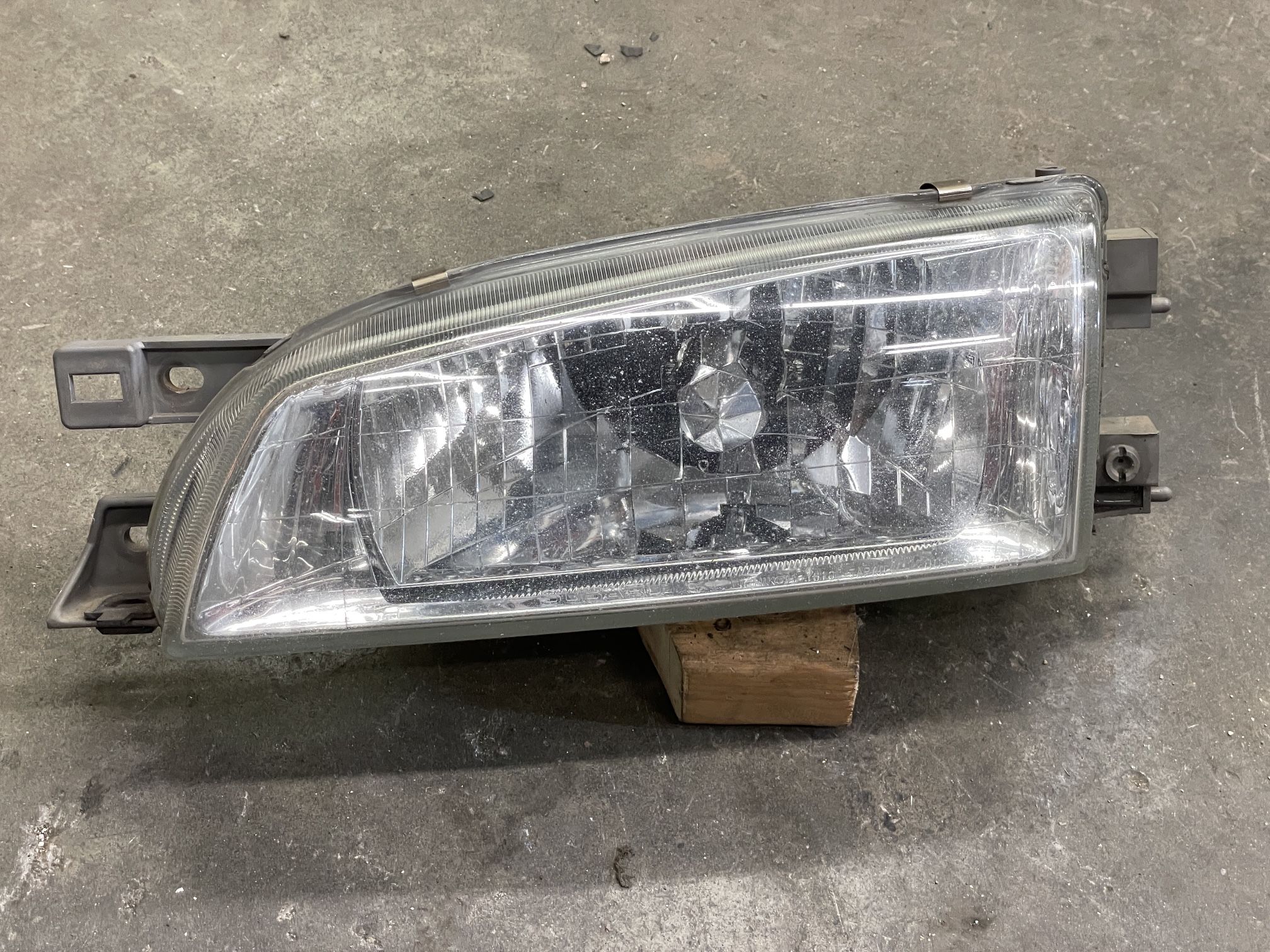 98-01 Subaru Impreza LH drivers clear glass headlight