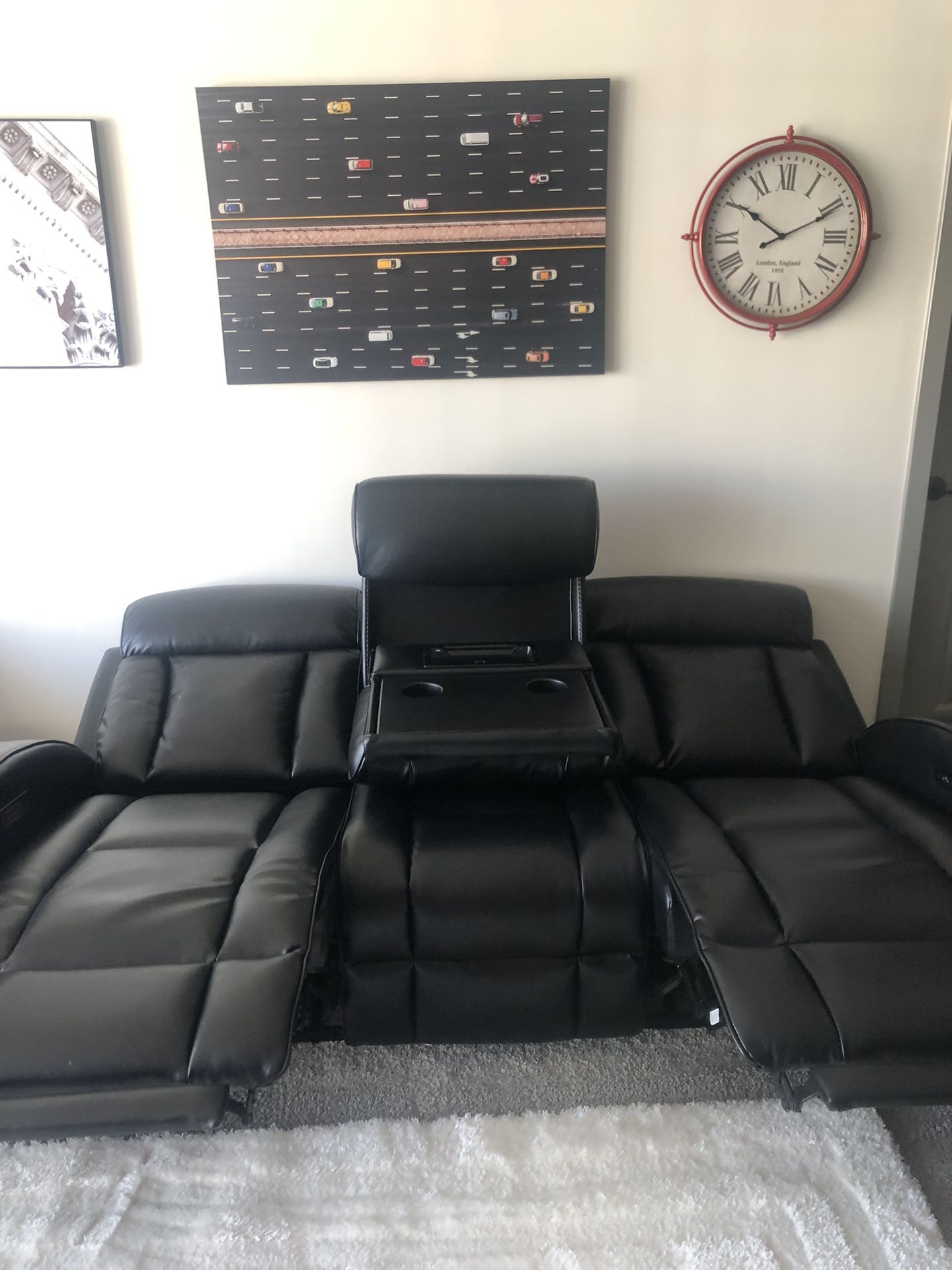 Black faux leather Power reclining sofa
