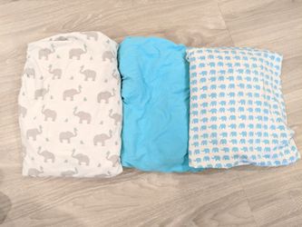 All nursery items. Elephants giraffes. Blue gray white. Sheets changing table covers crib mattress protectors blankets