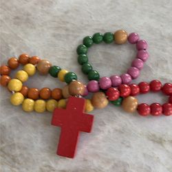 Multicolored Wooden Children’s First Rosary by https://offerup.com/redirect/?o=Um9zYXJ5LmNvbQ==