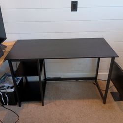 Black metal work desk with selves