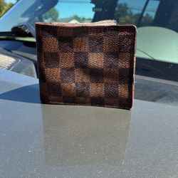 A Very Rare, Louis Vuitton Wallet With The Red Print A.K.A. Stamp