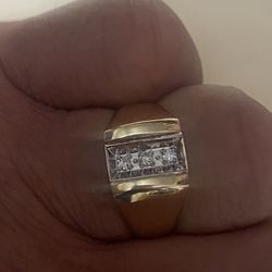 10-carat solid gold ring with three real diamonds, regular price is $1,800 I'm asking for $480 the price is firm.