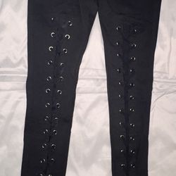 Black skinny pants with lace-up eyelet details