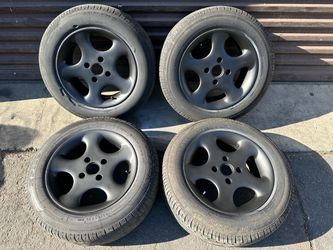 Set of four 15x7 inch aluminum wheels with old tires 4 on 114.3 lugs.