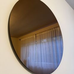Two Different Round Mirrors