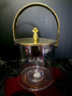 Spritz clear Lucite ice bucket with a gold-tone pineapple handle.