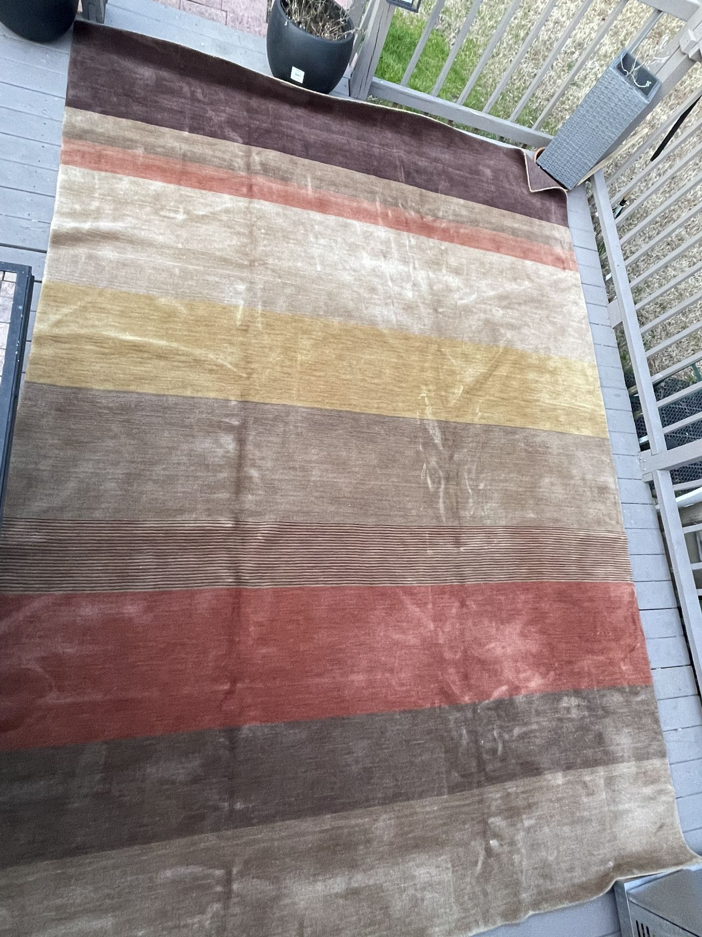 stripped hand made wool rug 10’x14’ pets and smoke free home serious contact only