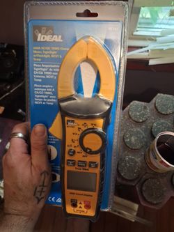 Brand new still in package professional digital multimeter with voltage probes and amp clamp