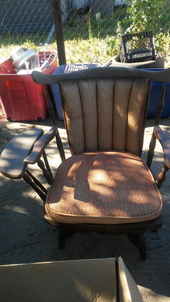 Old vintage chair with a built-in table on the side