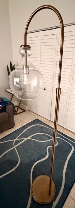 Modern Brass Arc Floor Lamp with Glass Globe Shade