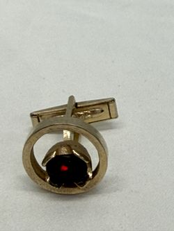 Men's Swank cufflinks, vintage model with a round design, made in gold color with a red stone in the center