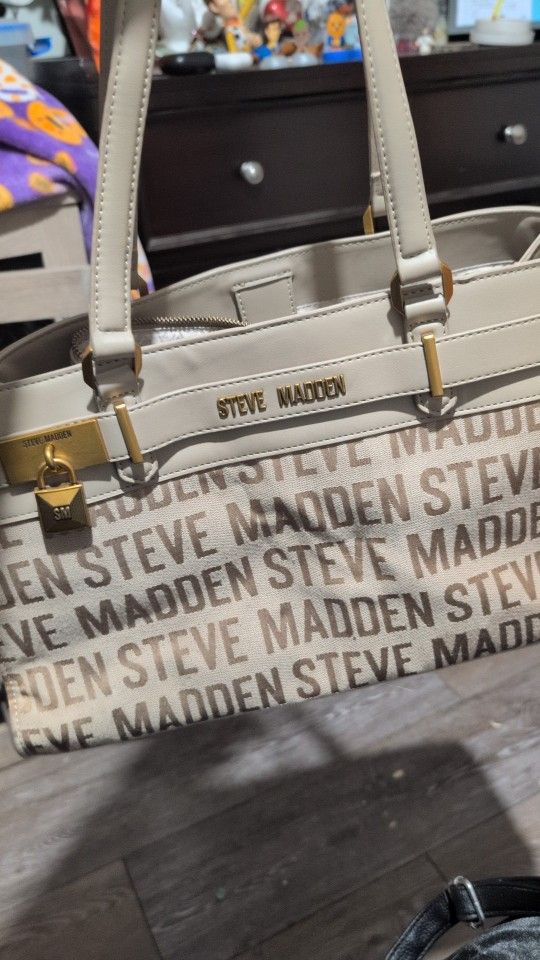 Steve Madden handbag with a logo print and padlock detail.